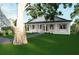 Picturesque single-story home with a charming front porch and lush green lawn at 1727 Barrow St, Deltona, FL 32725