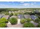 Aerial view of a community lined with mature trees and beautiful homes at 1825 Saffron Plum Ln, Orlando, FL 32828
