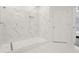 Modern bathroom features a glass-enclosed shower with marble-look tiling and a built-in shelf at 1825 Saffron Plum Ln, Orlando, FL 32828