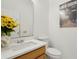 Bathroom featuring a vanity with marble countertop and a decorative vase at 1825 Saffron Plum Ln, Orlando, FL 32828