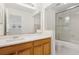 Bright bathroom featuring a white vanity with a single sink and shower at 1825 Saffron Plum Ln, Orlando, FL 32828