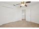 Neutral colored bedroom with a ceiling fan and large closet at 1825 Saffron Plum Ln, Orlando, FL 32828