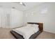 Bright bedroom with three accent windows and a contemporary platform bed at 1825 Saffron Plum Ln, Orlando, FL 32828