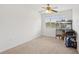 A simple bedroom featuring neutral carpet and an open window at 1825 Saffron Plum Ln, Orlando, FL 32828