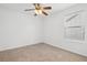 A naturally lit, carpeted bedroom with a ceiling fan at 1825 Saffron Plum Ln, Orlando, FL 32828