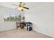A simple bedroom featuring neutral carpet and an open window at 1825 Saffron Plum Ln, Orlando, FL 32828
