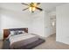 Bedroom featuring neutral carpet, platform bed, closet, and natural light from windows at 1825 Saffron Plum Ln, Orlando, FL 32828