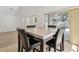 Bright dining room with sliding door access and large window at 1825 Saffron Plum Ln, Orlando, FL 32828