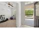 Entryway view leading to an open front porch, and to a bright home gym/office at 1825 Saffron Plum Ln, Orlando, FL 32828