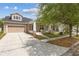 Charming home featuring a well manicured front yard and a two-car garage at 1825 Saffron Plum Ln, Orlando, FL 32828