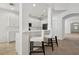 Modern white kitchen with breakfast bar and stainless steel appliances at 1825 Saffron Plum Ln, Orlando, FL 32828