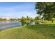 The scenic view of the lake with lush green grass at 1825 Saffron Plum Ln, Orlando, FL 32828