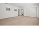 Open floor plan, with neutral carpet and view of staircase at 1825 Saffron Plum Ln, Orlando, FL 32828