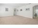 Spacious carpeted living room with neutral paint, recessed lighting, and framed pictures on the walls at 1825 Saffron Plum Ln, Orlando, FL 32828