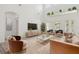 Bright living room with high ceilings, neutral decor, and modern furnishings at 1825 Saffron Plum Ln, Orlando, FL 32828