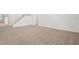 Spacious living room with plush carpeting and a staircase leading to the upper level at 1825 Saffron Plum Ln, Orlando, FL 32828