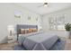 The main bedroom features a ceiling fan, and multiple windows that bring natural light at 1825 Saffron Plum Ln, Orlando, FL 32828