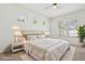 The main bedroom has a ceiling fan and large windows that bring natural light at 1825 Saffron Plum Ln, Orlando, FL 32828