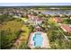 An aerial view shows a pool within the community at 1825 Saffron Plum Ln, Orlando, FL 32828