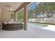Screened outdoor pool area with comfortable seating and a ceiling fan at 1825 Saffron Plum Ln, Orlando, FL 32828