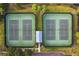 Overhead view of tennis courts with lush green surroundings and a central shelter at 1825 Saffron Plum Ln, Orlando, FL 32828