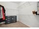 Spacious walk-in closet features built-in shelving and ample storage space for clothes and accessories at 1825 Saffron Plum Ln, Orlando, FL 32828
