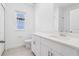 Bathroom featuring modern vanity with a sleek countertop and updated fixtures at 1912 Archer Dr, Minneola, FL 34715
