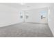 Spacious bedroom with three windows offering natural light and neutral color palette at 1912 Archer Dr, Minneola, FL 34715