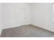 Empty bedroom with neutral walls and carpet, offering a blank canvas at 1912 Archer Dr, Minneola, FL 34715