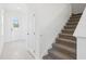 Hallway view features the front door, stairway, and coat closet at 1912 Archer Dr, Minneola, FL 34715