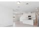 An open-concept kitchen with stainless steel appliances, island, and tile flooring at 1912 Archer Dr, Minneola, FL 34715