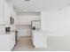 Bright kitchen featuring white cabinetry, stainless steel appliances, and center island at 1912 Archer Dr, Minneola, FL 34715
