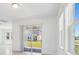 Sun-filled living room with sliding glass door and tile flooring at 1912 Archer Dr, Minneola, FL 34715