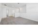 Bright loft space featuring neutral carpet and access to multiple rooms at 1912 Archer Dr, Minneola, FL 34715