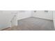 Upstairs loft area with soft carpeting, white walls, and natural light at 1912 Archer Dr, Minneola, FL 34715
