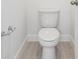 Modern toilet room with ceramic tile flooring at 1912 Archer Dr, Minneola, FL 34715