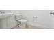 Toilet room with pedestal sink and ceramic tile flooring at 1912 Archer Dr, Minneola, FL 34715