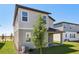 Home exterior with a covered patio and lawn at 2236 Hen Rd, Minneola, FL 34715