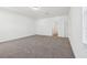 Spacious bedroom with carpet, neutral paint and doorway to closet or bathroom at 2236 Hen Rd, Minneola, FL 34715