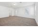 Large carpeted bedroom with neutral paint and doorway to closet or bathroom at 2236 Hen Rd, Minneola, FL 34715