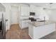 Bright kitchen showcasing granite countertops and stainless steel appliances at 2236 Hen Rd, Minneola, FL 34715