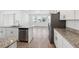 Kitchen featuring stainless steel appliances, granite countertops and eat in area at 2236 Hen Rd, Minneola, FL 34715