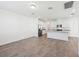 Well-lit open-concept kitchen with stainless steel appliances and white cabinetry, ideal for entertaining at 2236 Hen Rd, Minneola, FL 34715