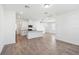 Modern kitchen featuring white cabinetry, granite countertops, and a functional island layout at 2236 Hen Rd, Minneola, FL 34715