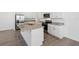 Kitchen featuring a large kitchen island with stainless steel appliances and granite countertops at 2236 Hen Rd, Minneola, FL 34715