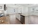 Kitchen featuring stainless steel appliances, granite countertops, and white cabinets at 2236 Hen Rd, Minneola, FL 34715