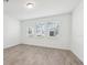 Bright, airy living room with neutral tile flooring and ample natural light from large windows at 2236 Hen Rd, Minneola, FL 34715