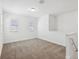 Upstairs loft featuring carpet, light-colored walls, and natural light at 2236 Hen Rd, Minneola, FL 34715
