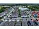 Neighborhood aerial shot reveals picturesque townhomes with a pond nearby at 2252 Emerald Springs Dr, Apopka, FL 32712