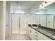 Bright bathroom features a glass shower with white tile and granite countertops at 2252 Emerald Springs Dr, Apopka, FL 32712